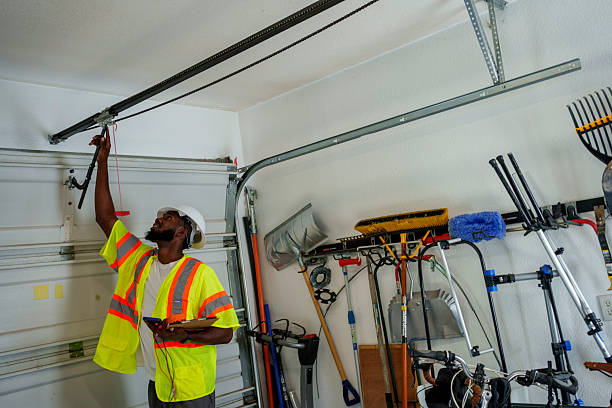 Professional Garage Door Panel Replacement technician working in Elyria, OH